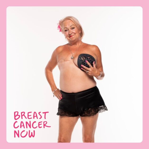 Tricia posing with a Boost Breast Form for Breast Cancer Now